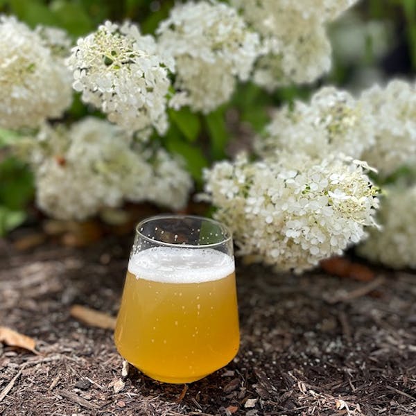 glass of beer with flowers