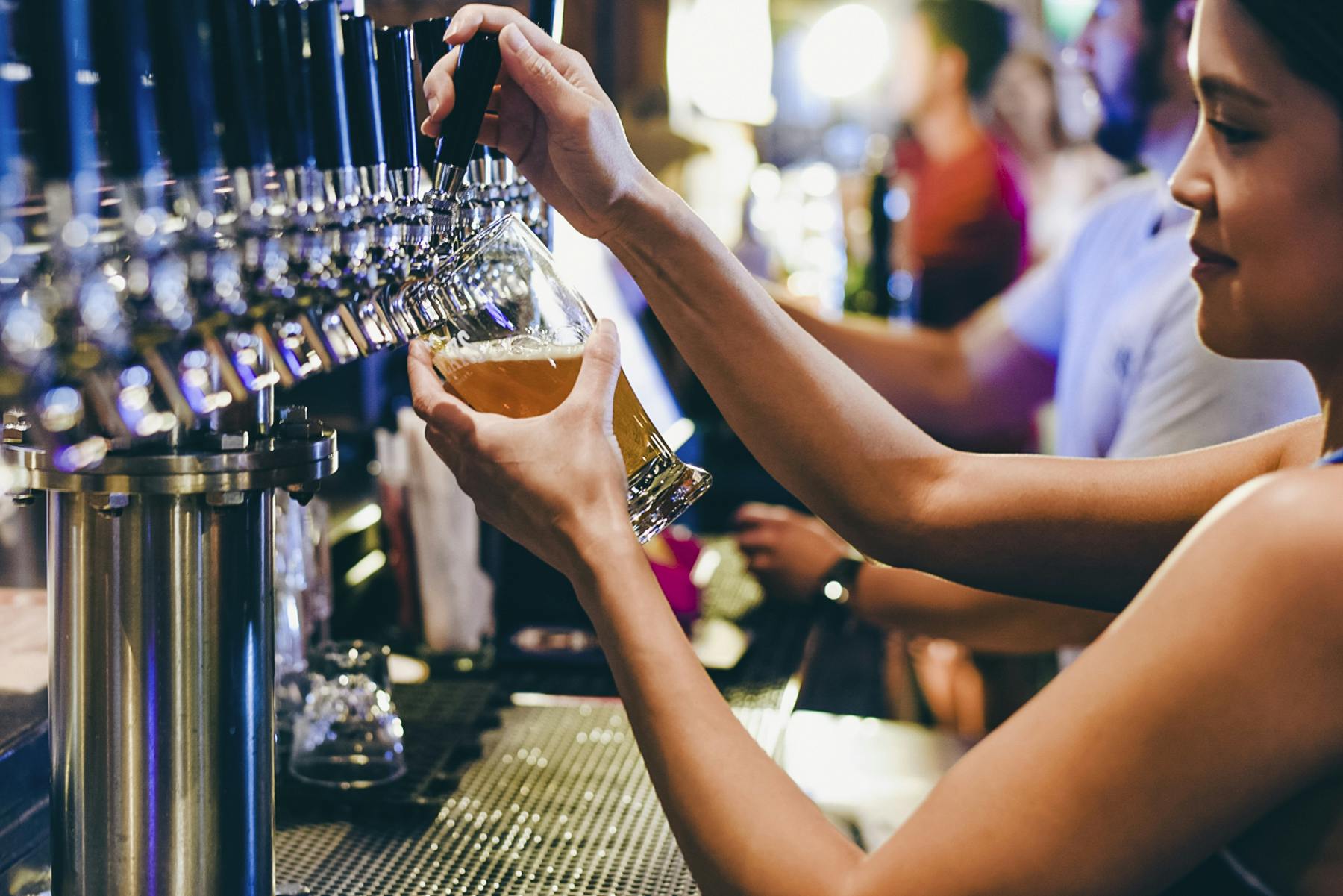 Photographer Beer being poured in the glass from the tap