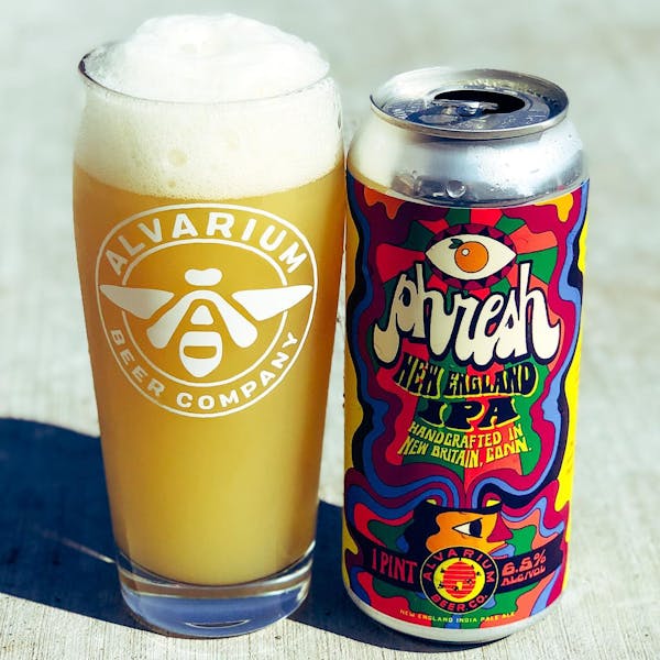 phresh new england IPA in pint glass with can