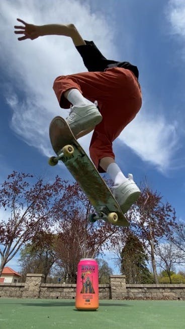 Skater jumping an ANXO can