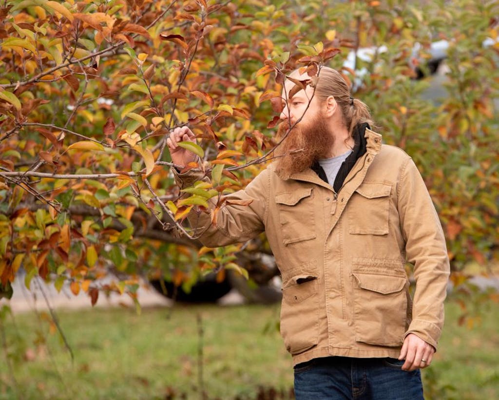Forbes - Sam with trees Sam Fitz, co-founder of ANXO cider in Washington D.C., inspects the orchard.