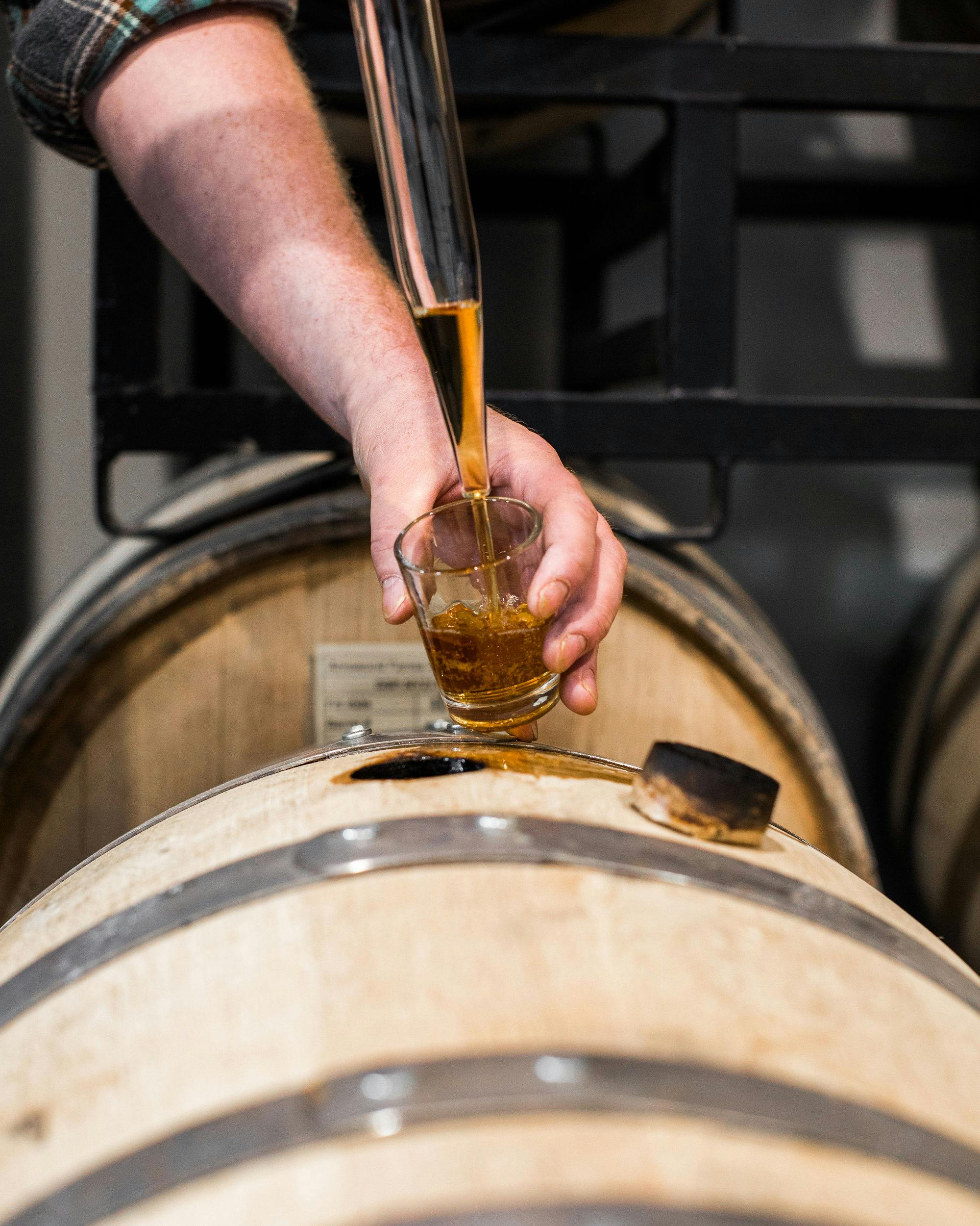 Pouring bourbon from a cask