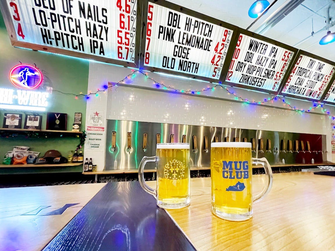 Loyalty Program from Kindsey Bernhard - two beers on a bar with a menu in the background