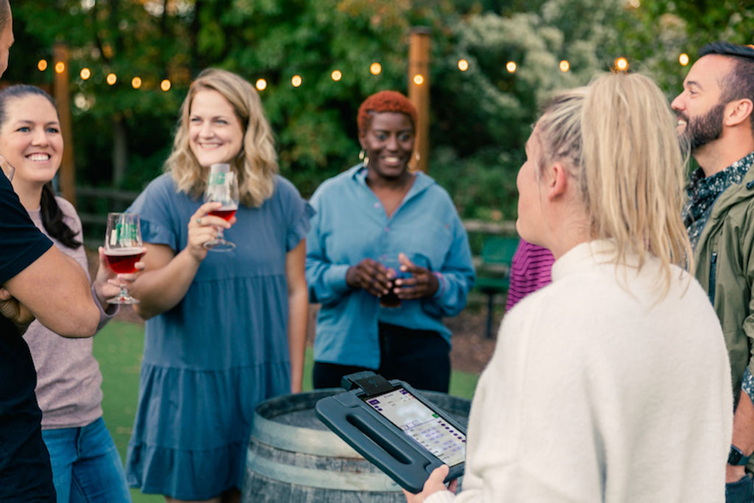 a group of guests enjoying beers outside