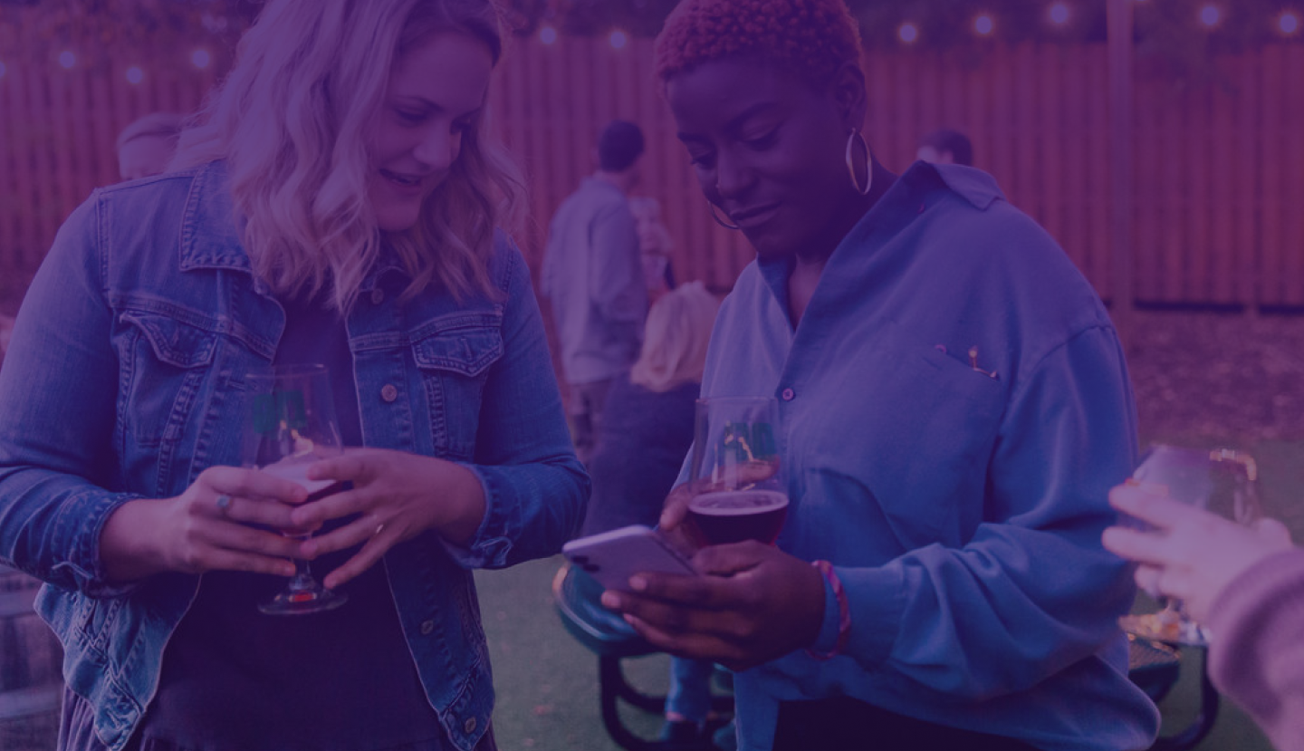photo of people drinking beer with dark purple overlay