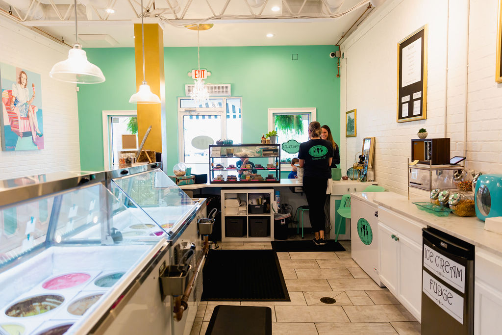 A view behind the counter at an ice cream shop