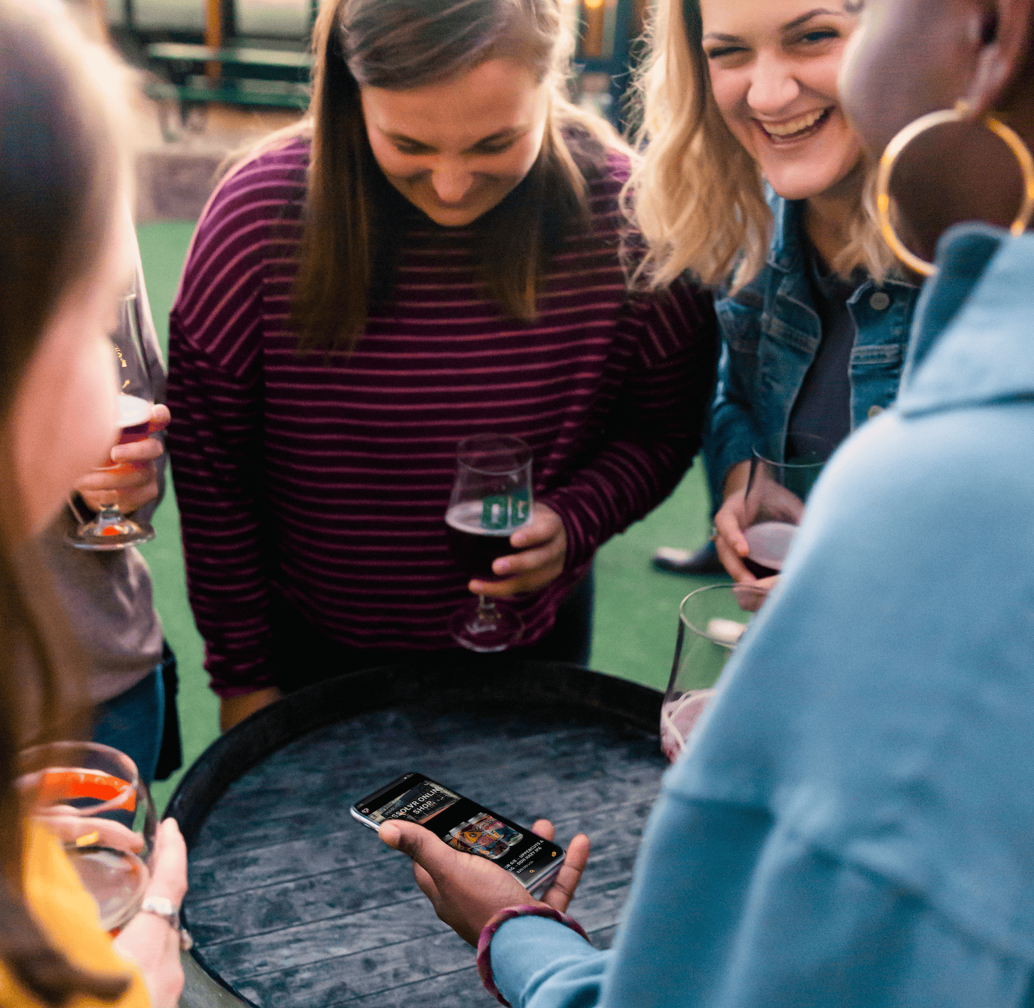 a group of guests enjoy beers outside