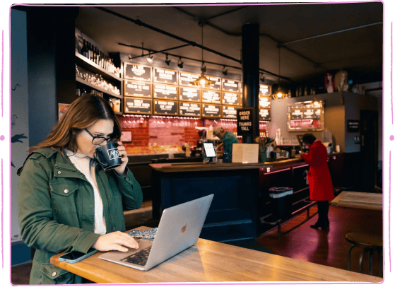 A business owner accesses POS reports on their laptop
