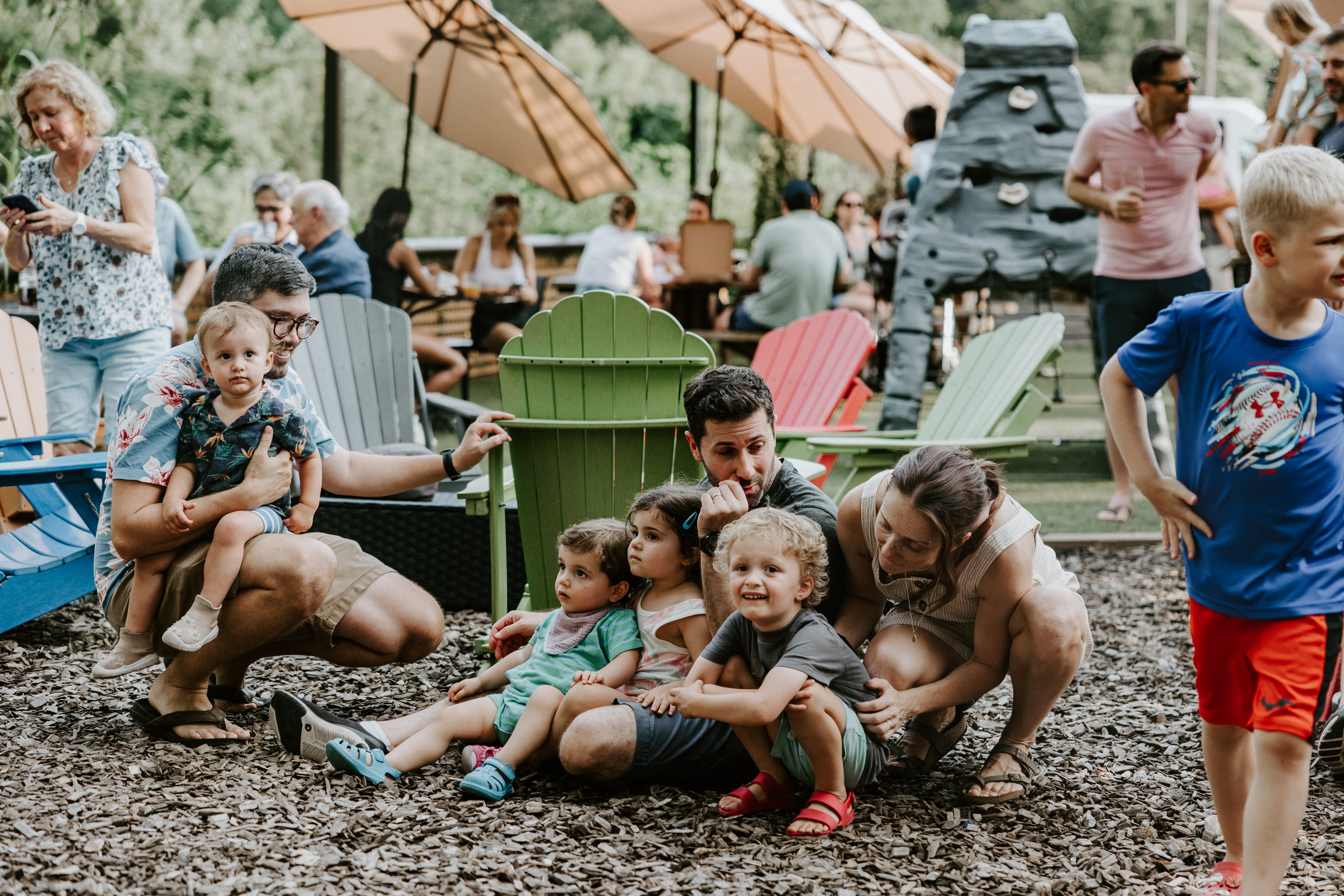 children sitting on ground at babycat brewery