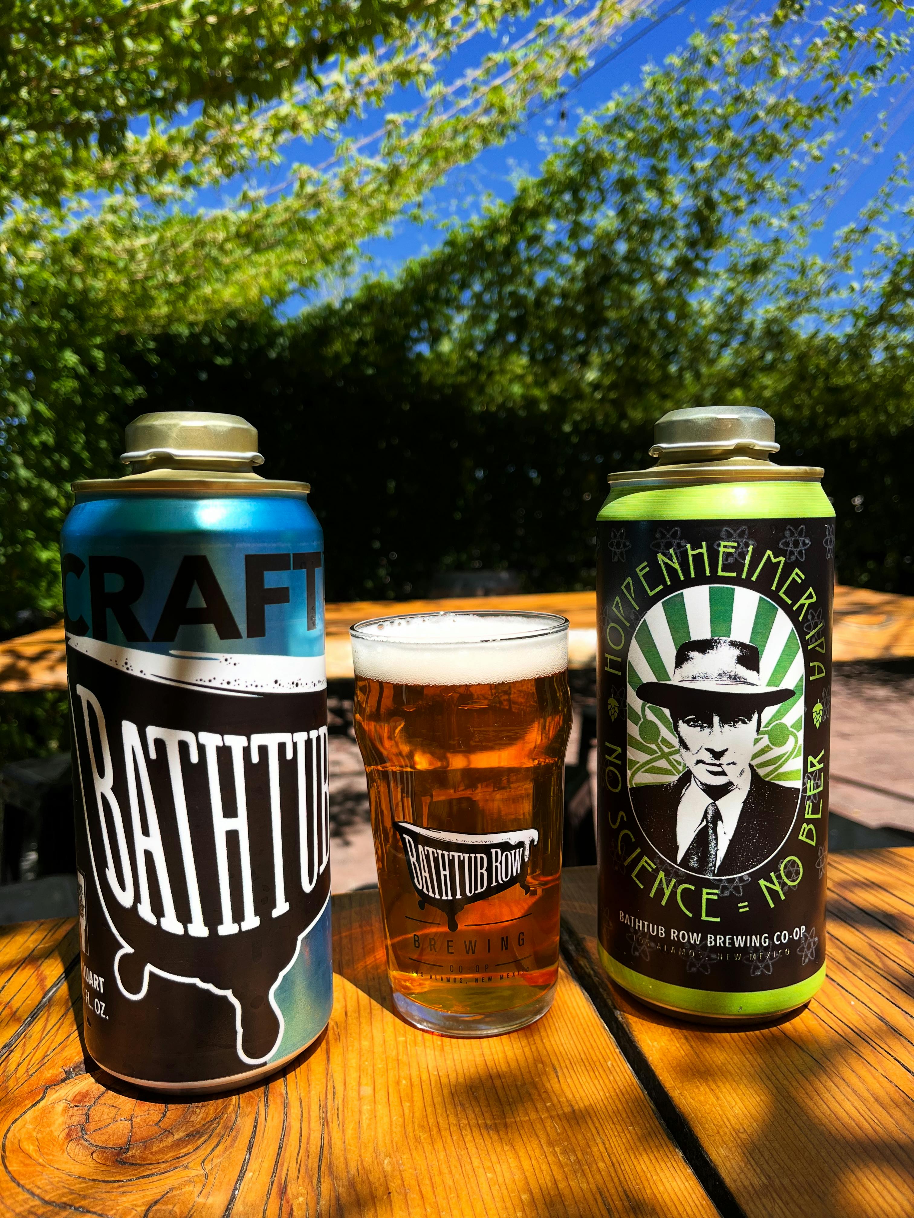 Two cans and a glass of Bathtub Row Beer 