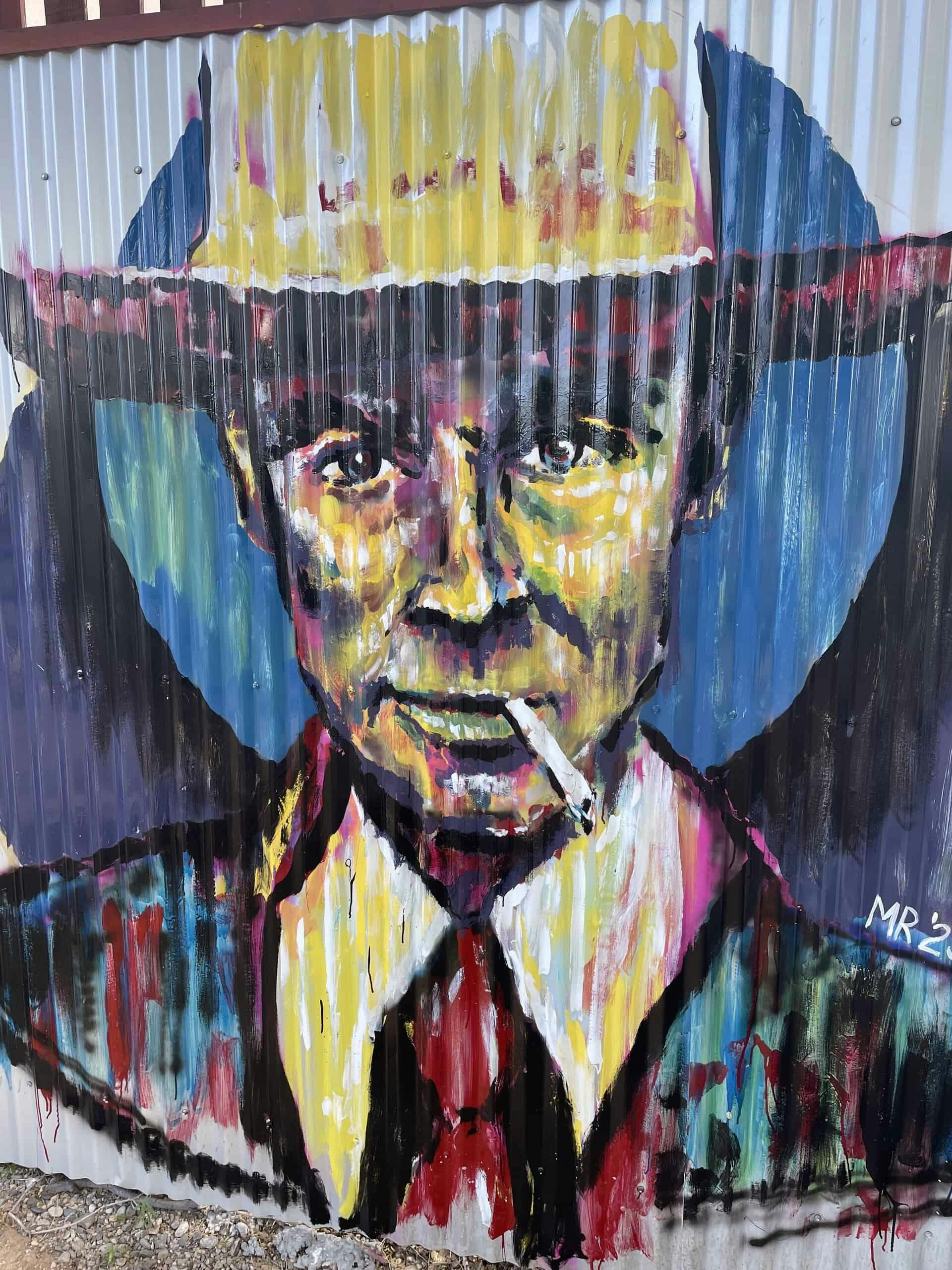 Colorful painted mural of Oppenheimer 
