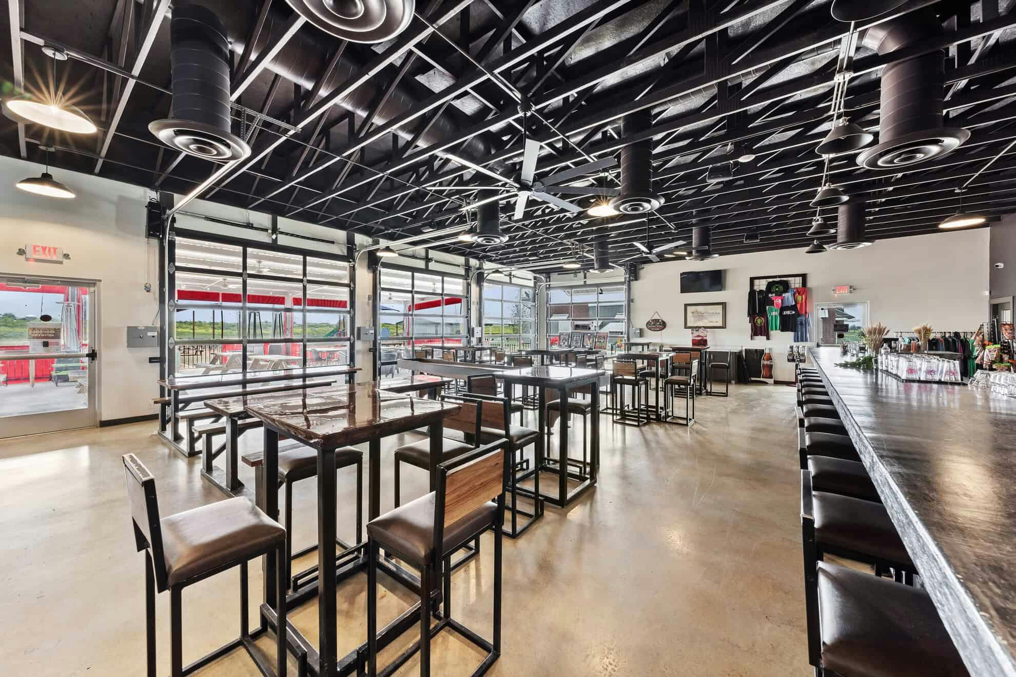 interior of Bold Republic taproom with grey bar and wooden bar stools