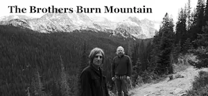 black and white photo, mountains in the back and 2 men