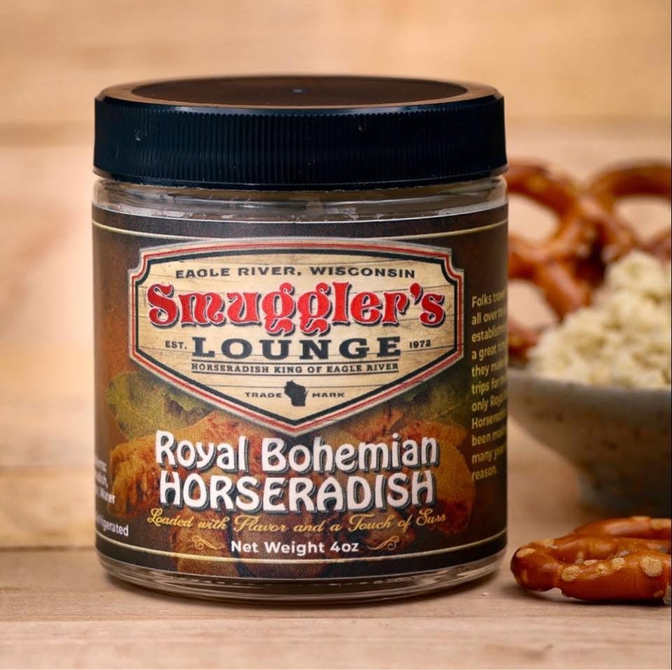a jar of smugglers horseradish with a bowl of pretzels