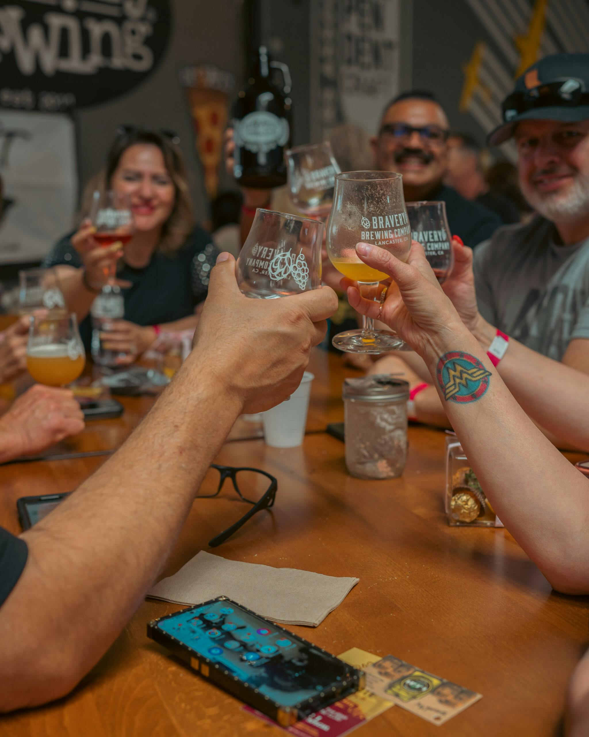 Group of people cheers with beers