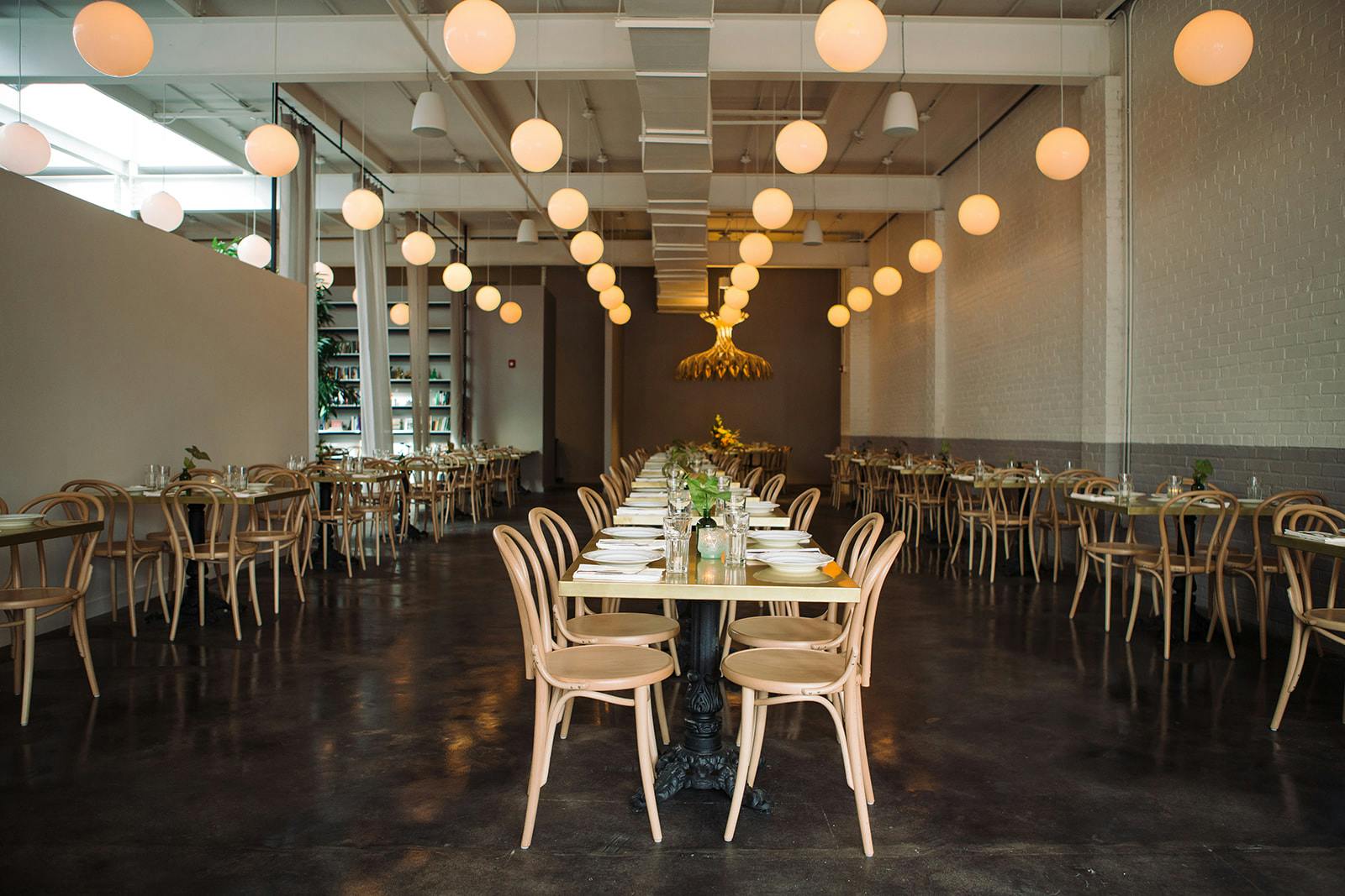 long tables with wooden cane chairs in the Brewery Bhavana taproom