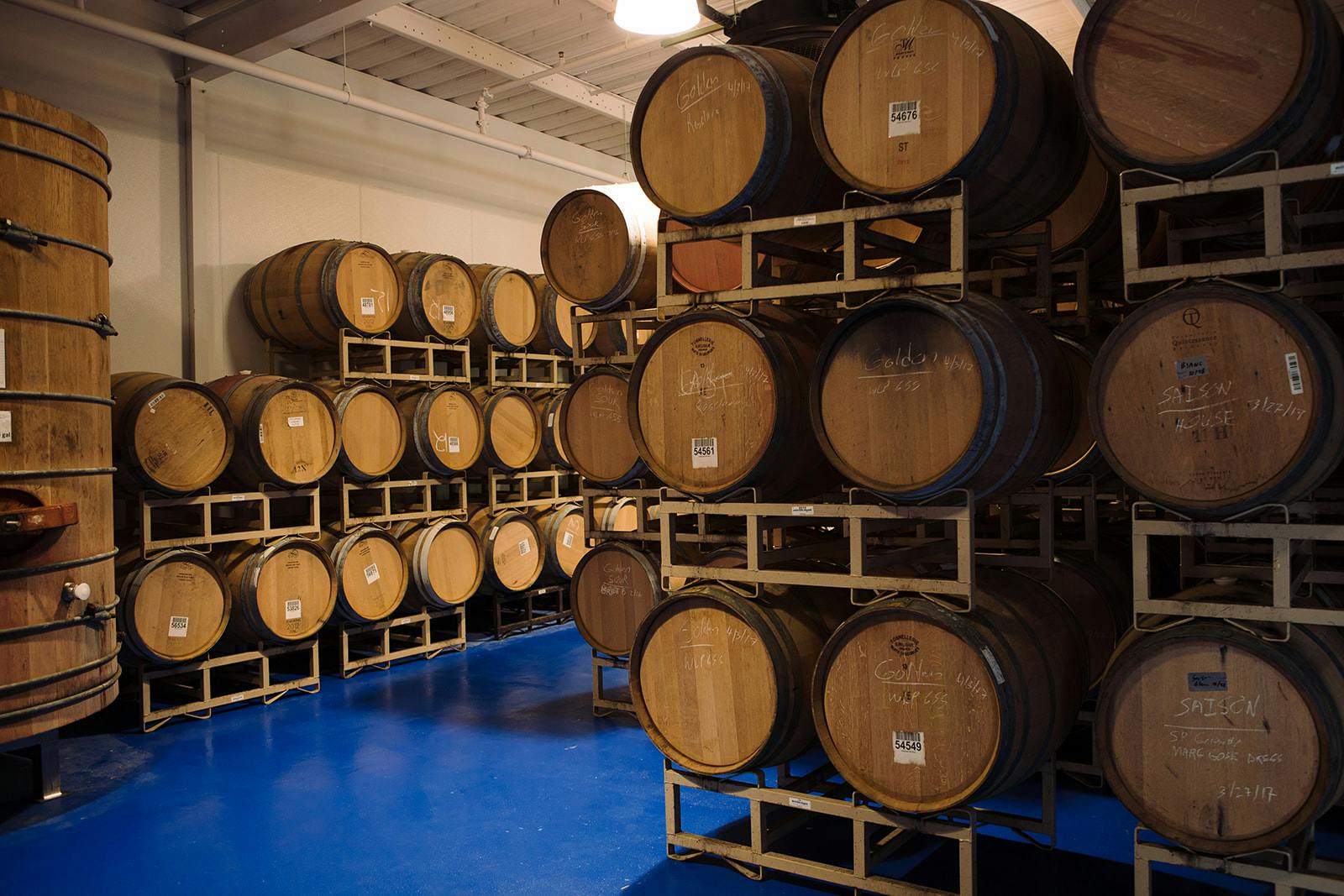 stacks of barrels in a cellar