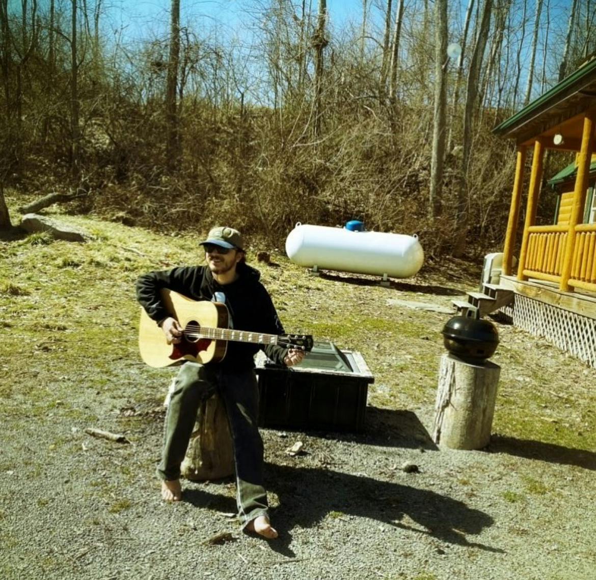 IMG_9130 Musician with guitar outside on a lawn
