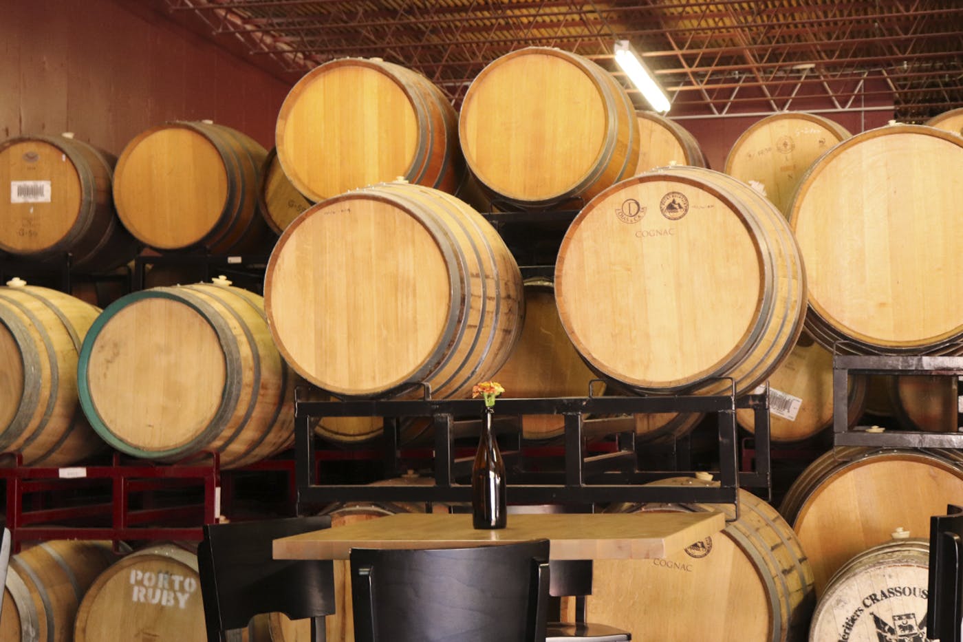 Photographer Wooden casks of sour beer in Casey Brewing cellar