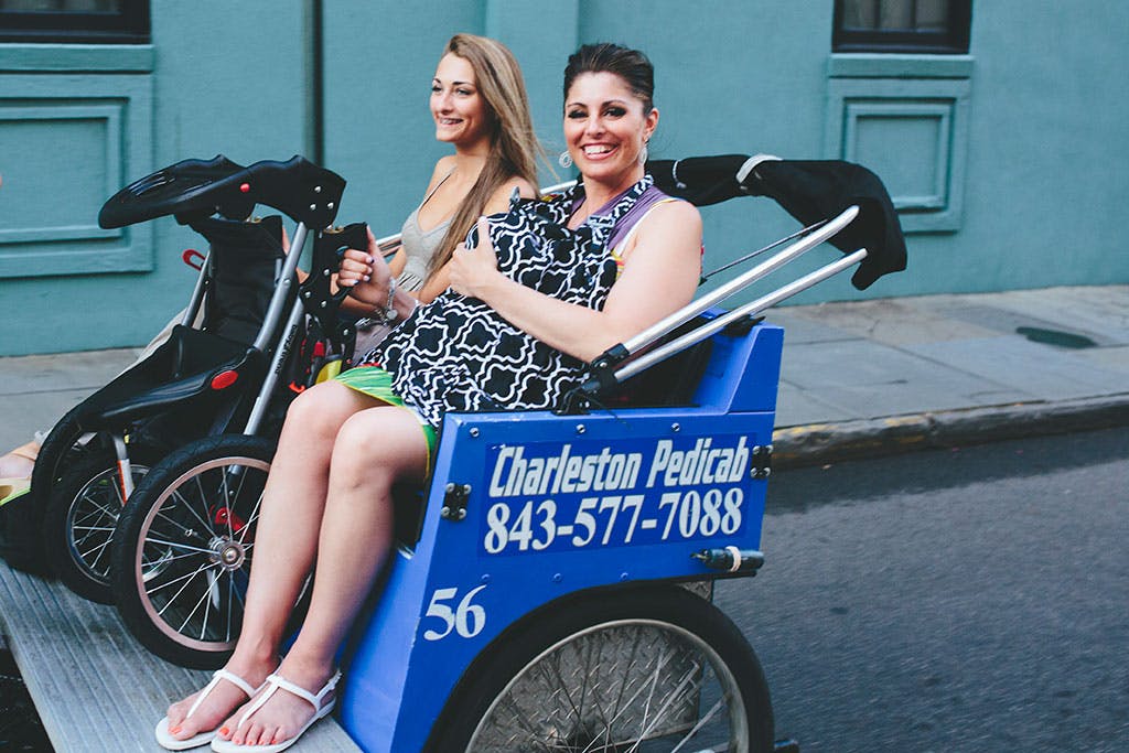 Smiling pedicab passengers