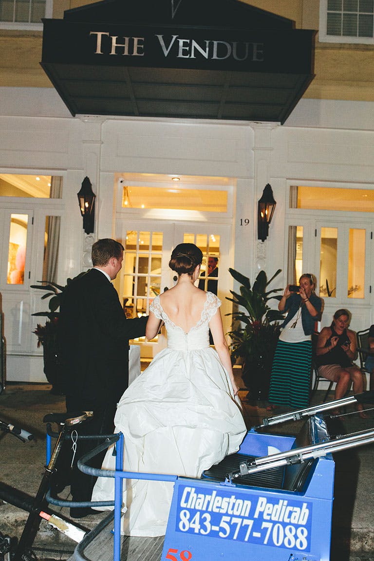 Bride and Groom walk into reception venue