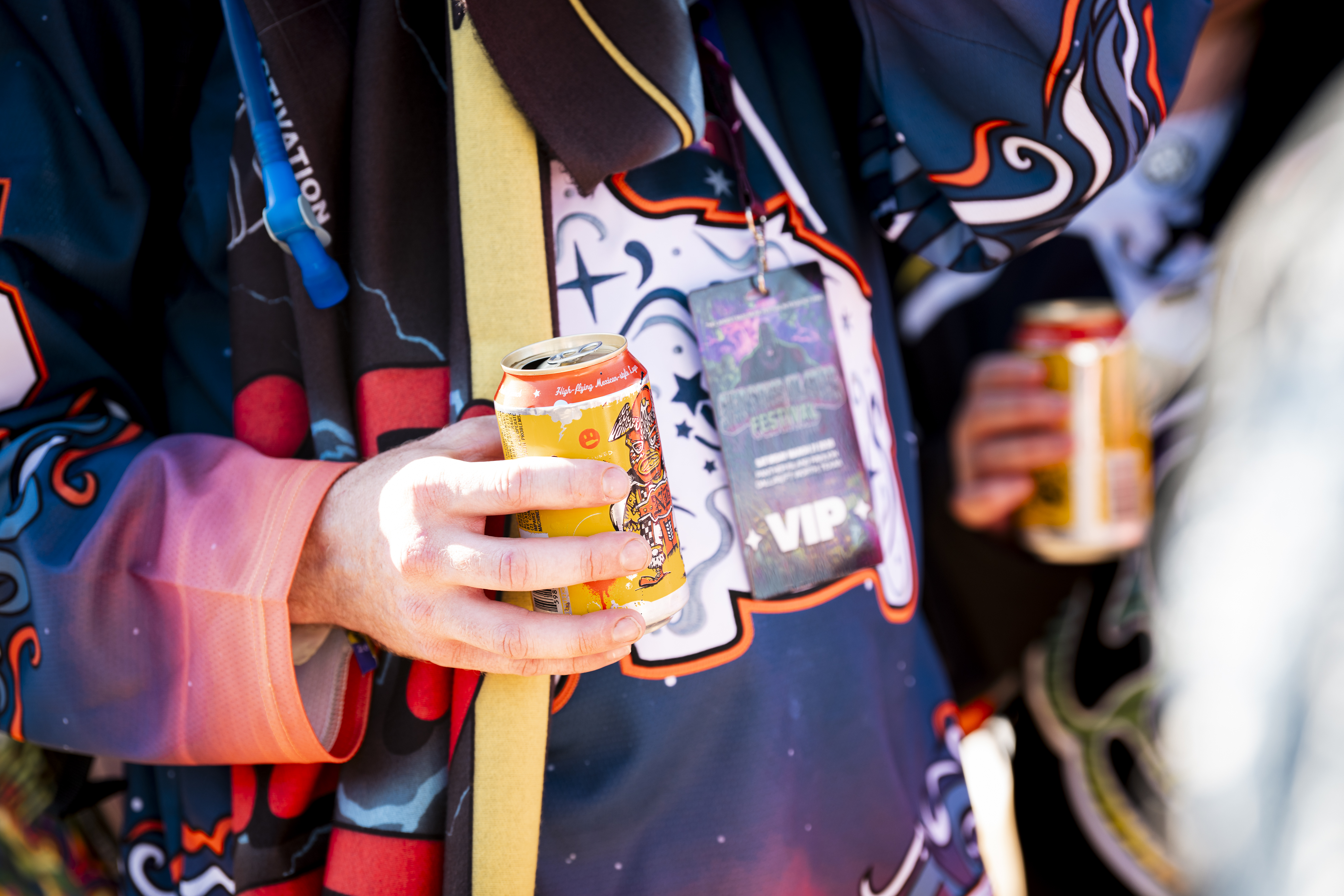 Concertgoer holding a Neato Bandito can by Deep Ellum Brewing Co. at Shaq's Bass All-Stars Festival 2026 in Fort Worth, Texas.