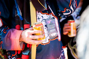 Concertgoer holding a Neato Bandito can by Deep Ellum Brewing Co. at Shaq's Bass All-Stars Festival 2026 in Fort Worth, Texas.