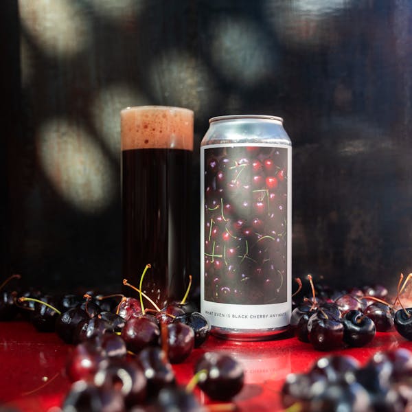 dark red beer in glass on table