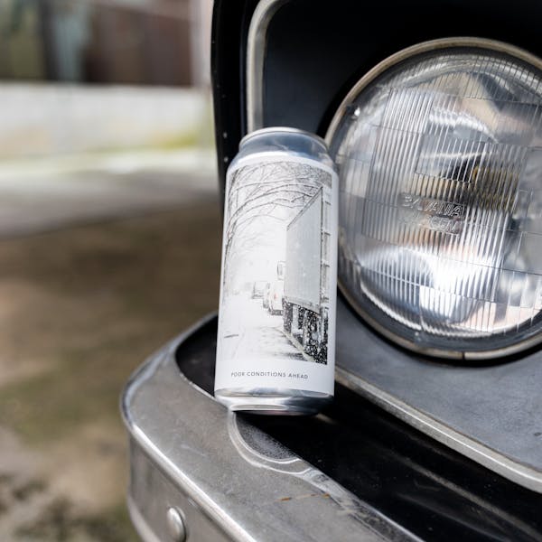 can of hazy IPA on car