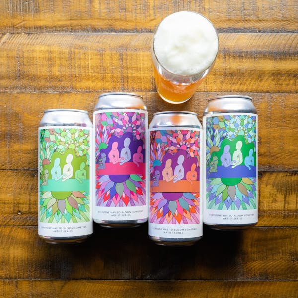 DSC01835 everyone has to bloom sometime cans on table