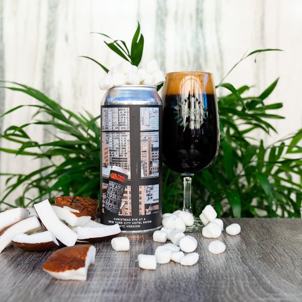 dark beer in glass on table with marshmallows