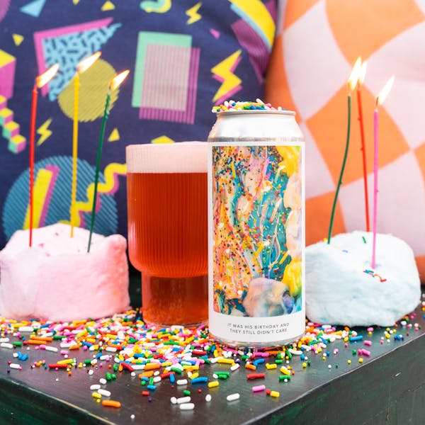pink beer in glass on table with birthday decor