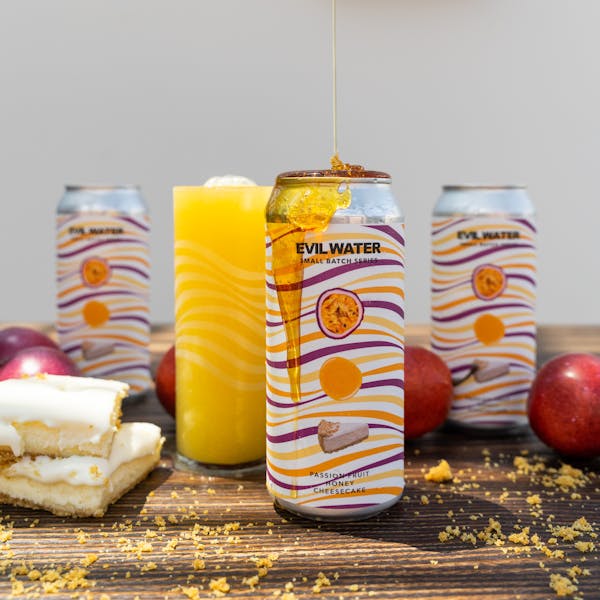 DSC09461 yellow seltzer in glass on table with honey and fruit