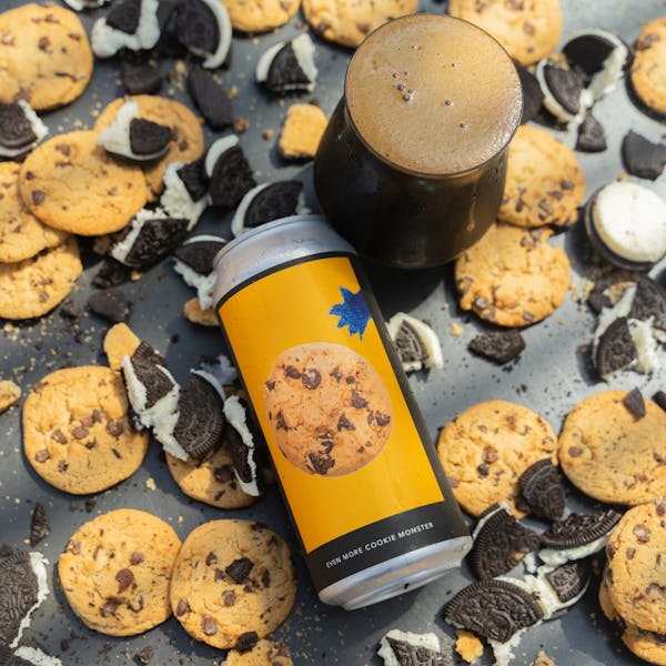 dark beer in glass on table with cookies