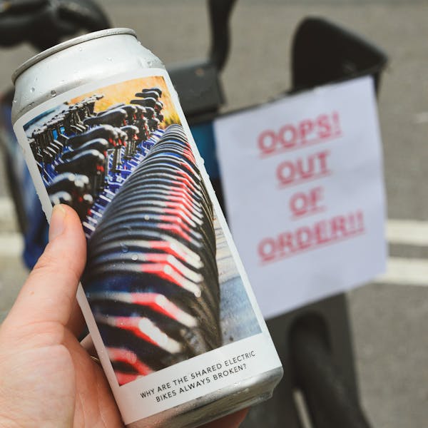 out of order sign with beer can bikes