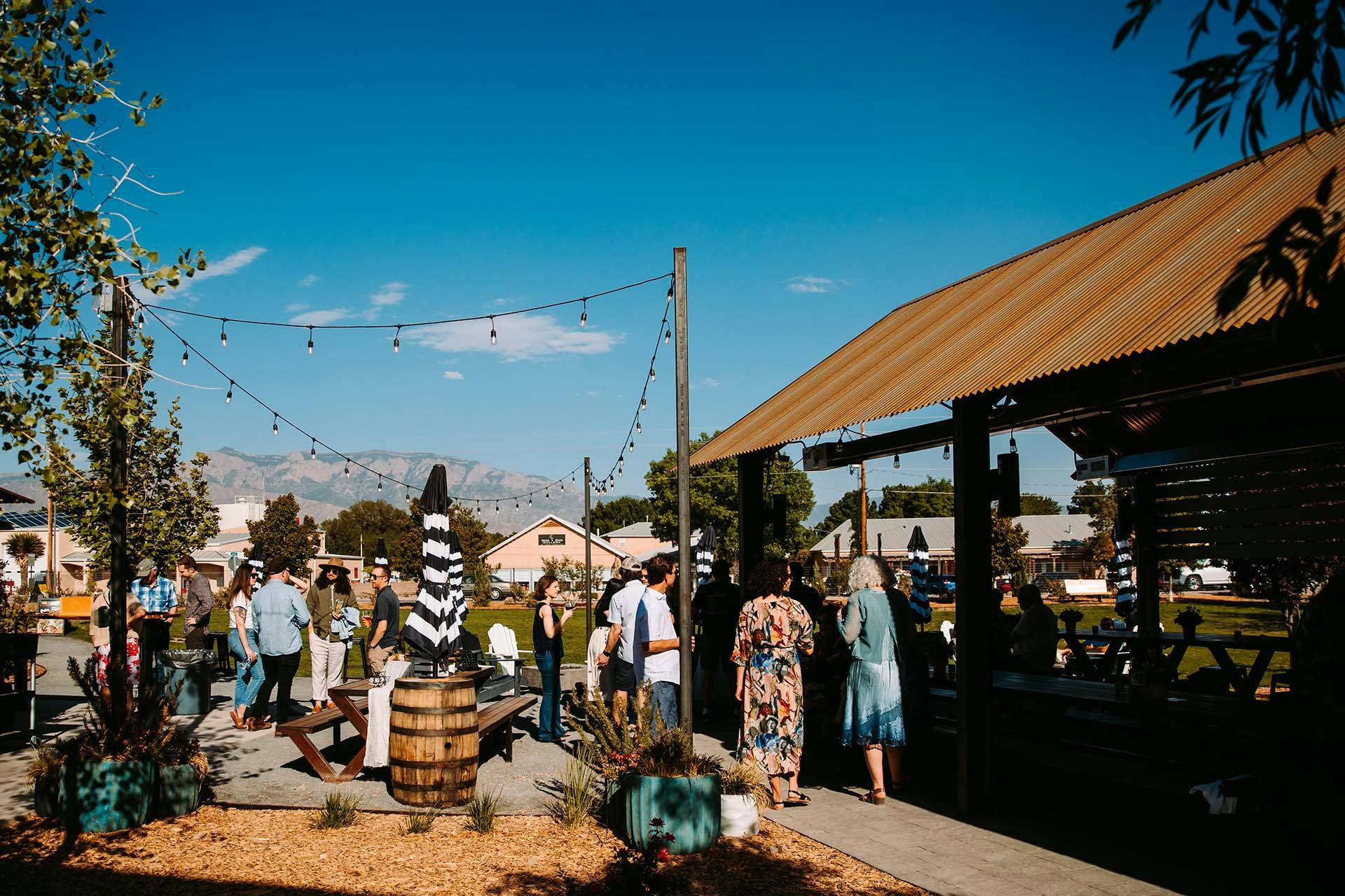 exterior of Corral at Ex Novo Brewing taproom - picnic benches and people