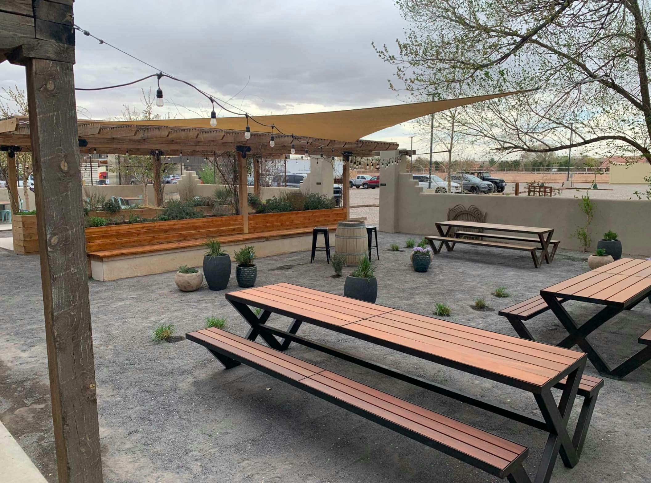 exterior of taproom with picnic benches