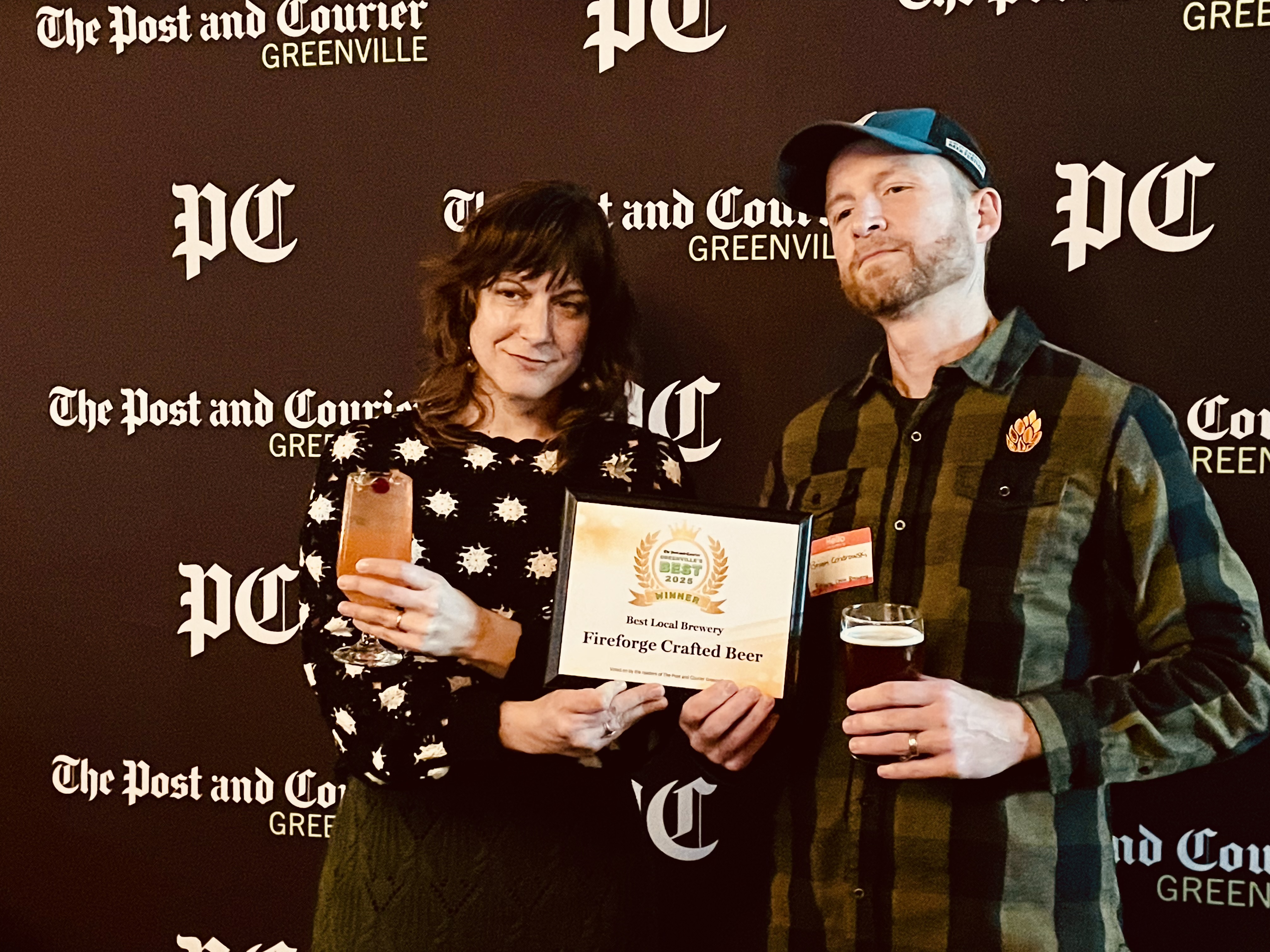 Fireforge Co-Owners Nicole & Brian Cendrowski accept the Best Local Brewery award. 
