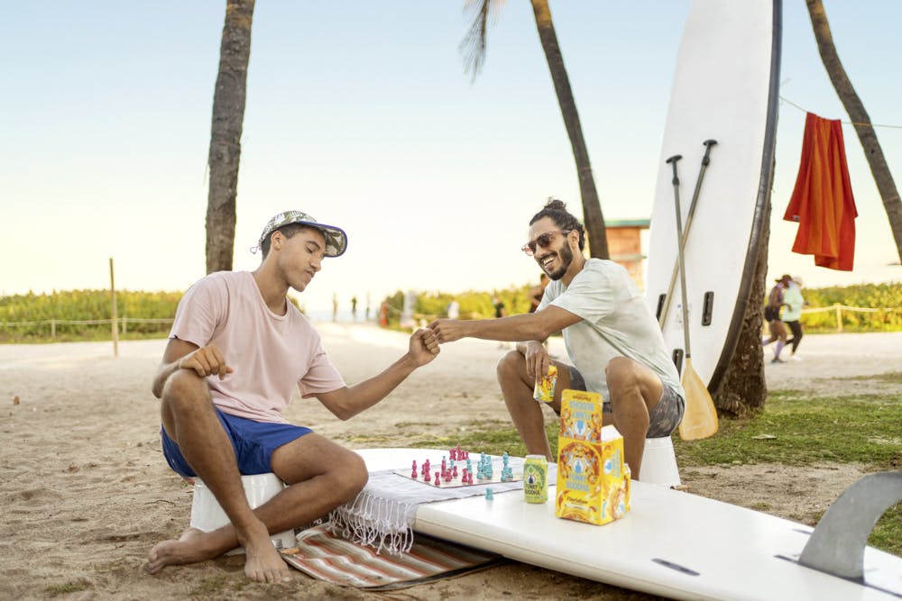 Photographer Drinking Funky Buddha beers on the beach