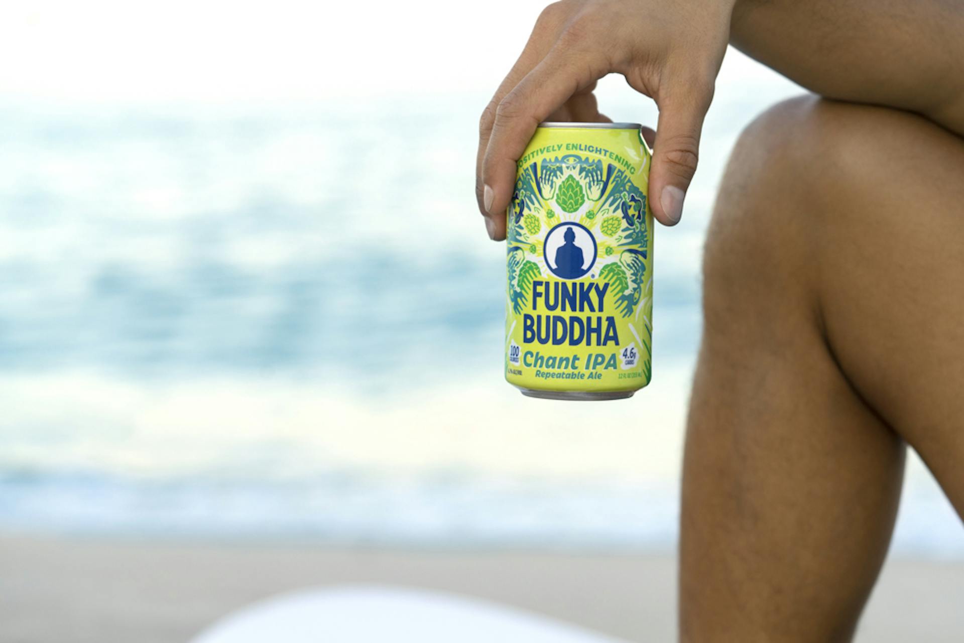 Photographer Drinking Funky Buddha beers on the beach