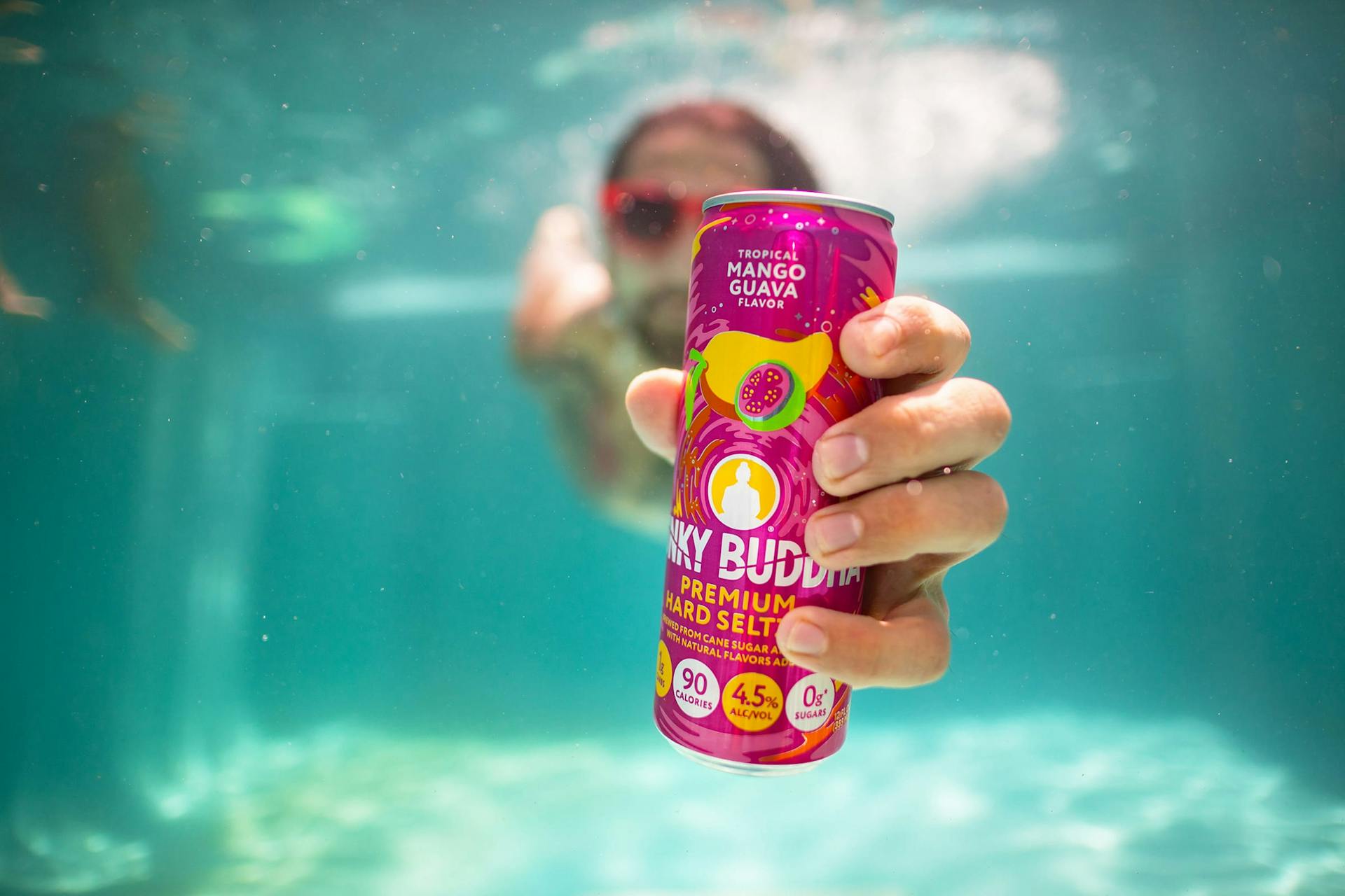 Man diving with Funky Buddha hard seltzer