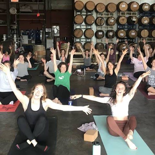 yoga class in brewery barrel room