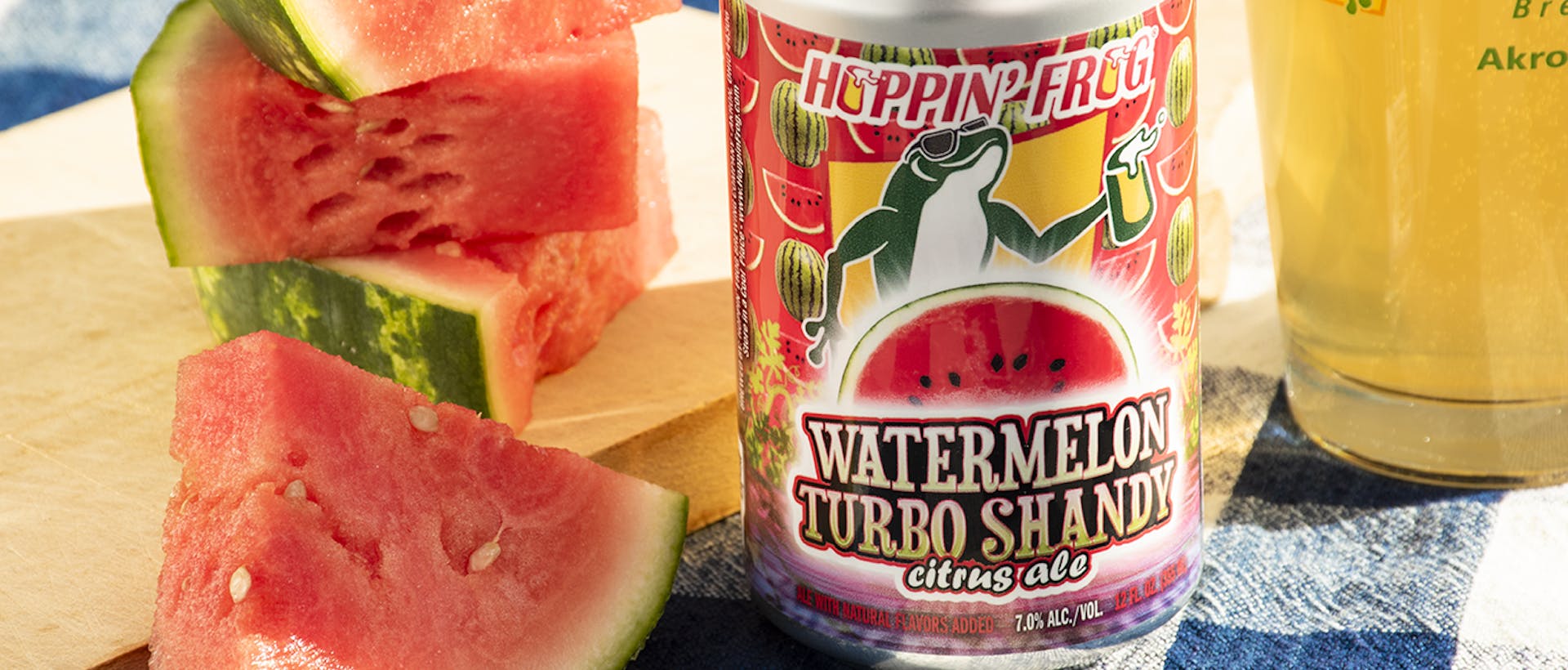 HF_Watermelon Turbo Shandy Citrus Ale_on table with watermelon pieces_2023 copy