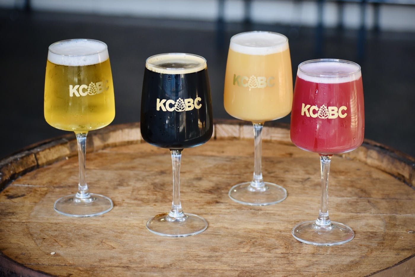 4 types of beer styles in long stem glasses