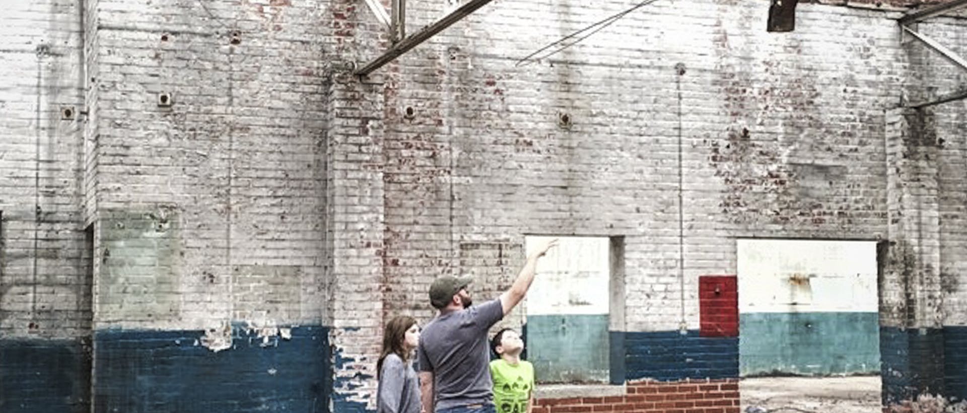 Terry the owner with his kids in the taproom before it was built