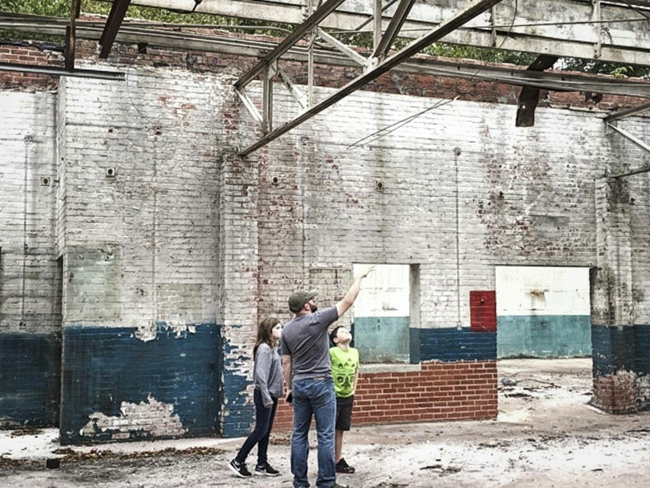 Terry the owner with his kids in the taproom before it was built