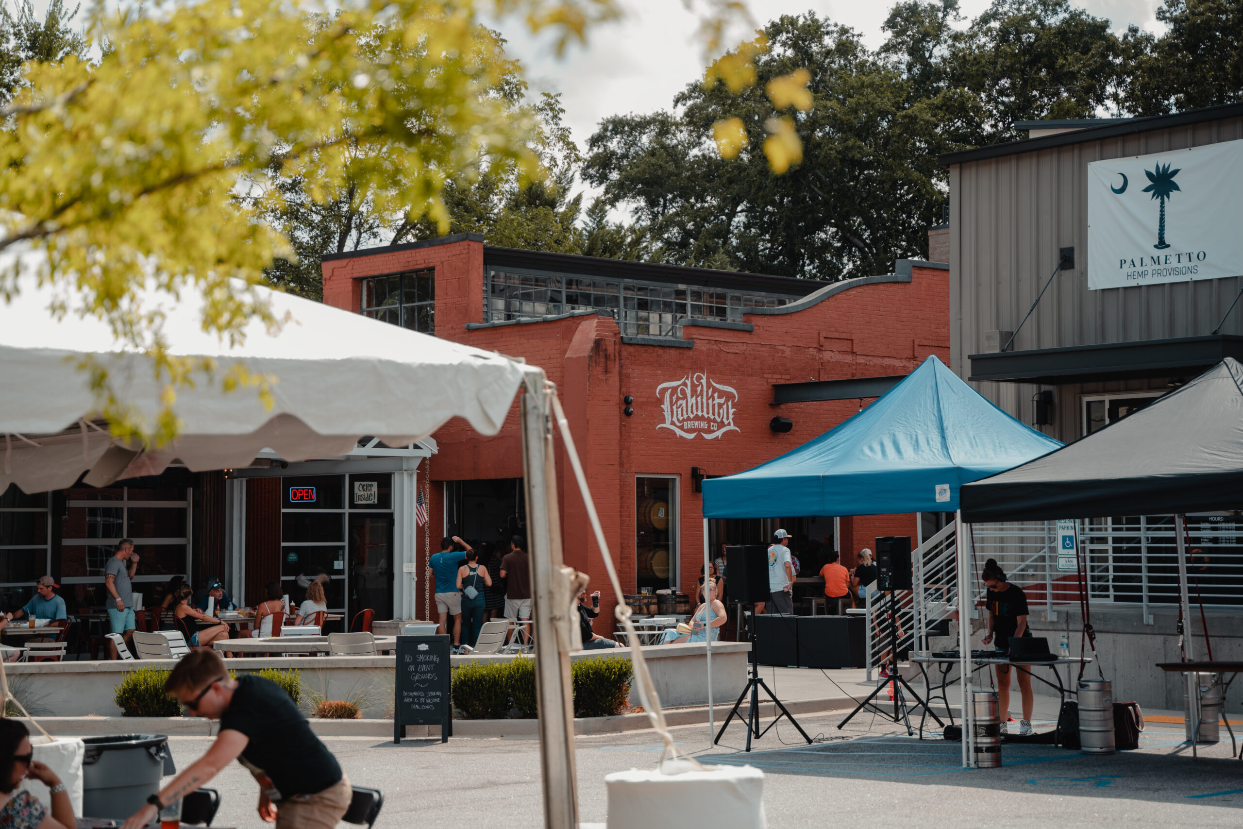 Moes Original Barbeque in Greenville celebrating partnership with Liability Brewing