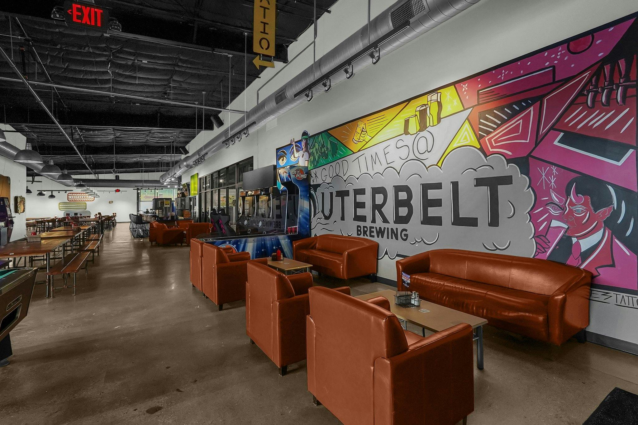 15-web-or-mls-3560-dolson-ct booths along a wall mural in the Outerbelt taproom