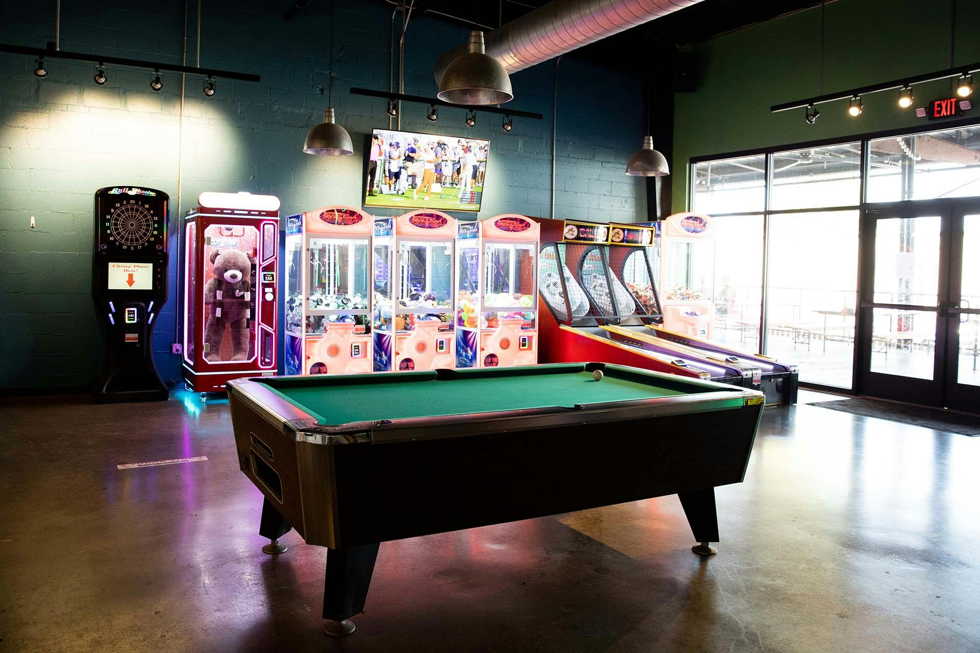 IMG_1059 Game area at the Outerbelt taproom with pool table, arcade games, and ski-ball