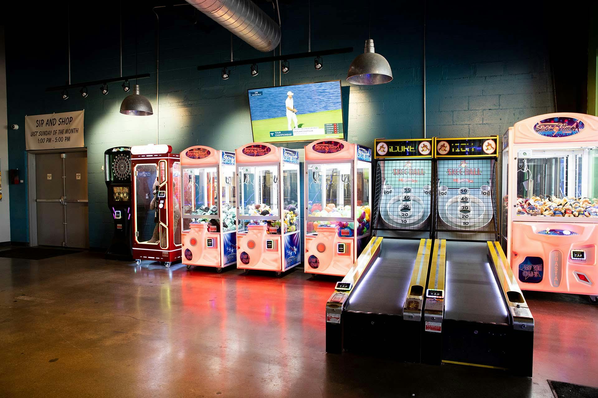 IMG_1060 arcade games against a long wall at the Outerbelt taproom